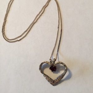 Sterling silver necklace with garnet stone.